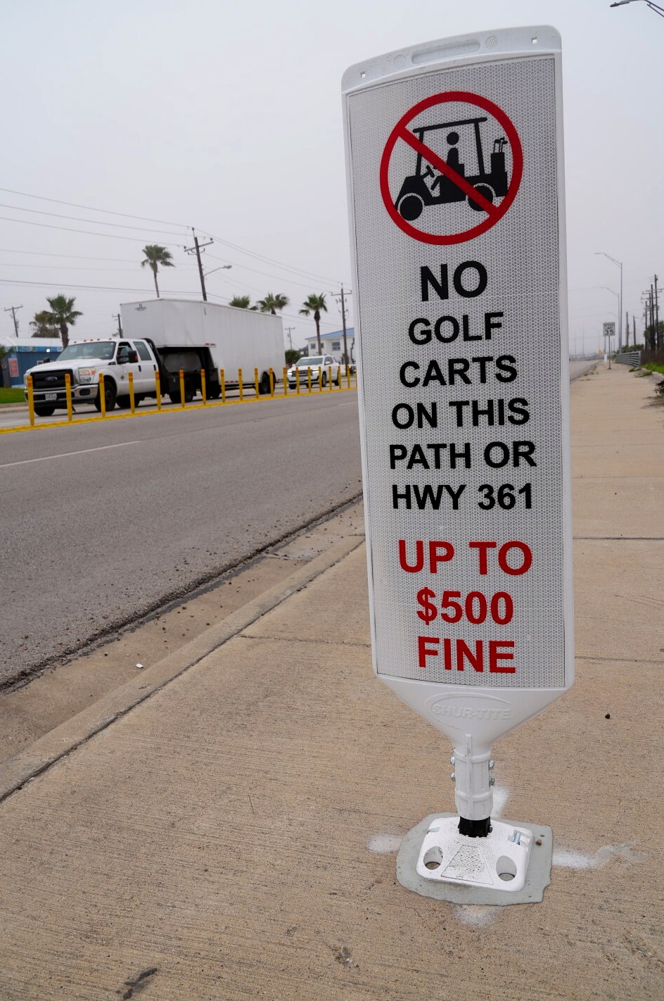 City of Port Aransas sign: no golf carts on this path or Hwy 361