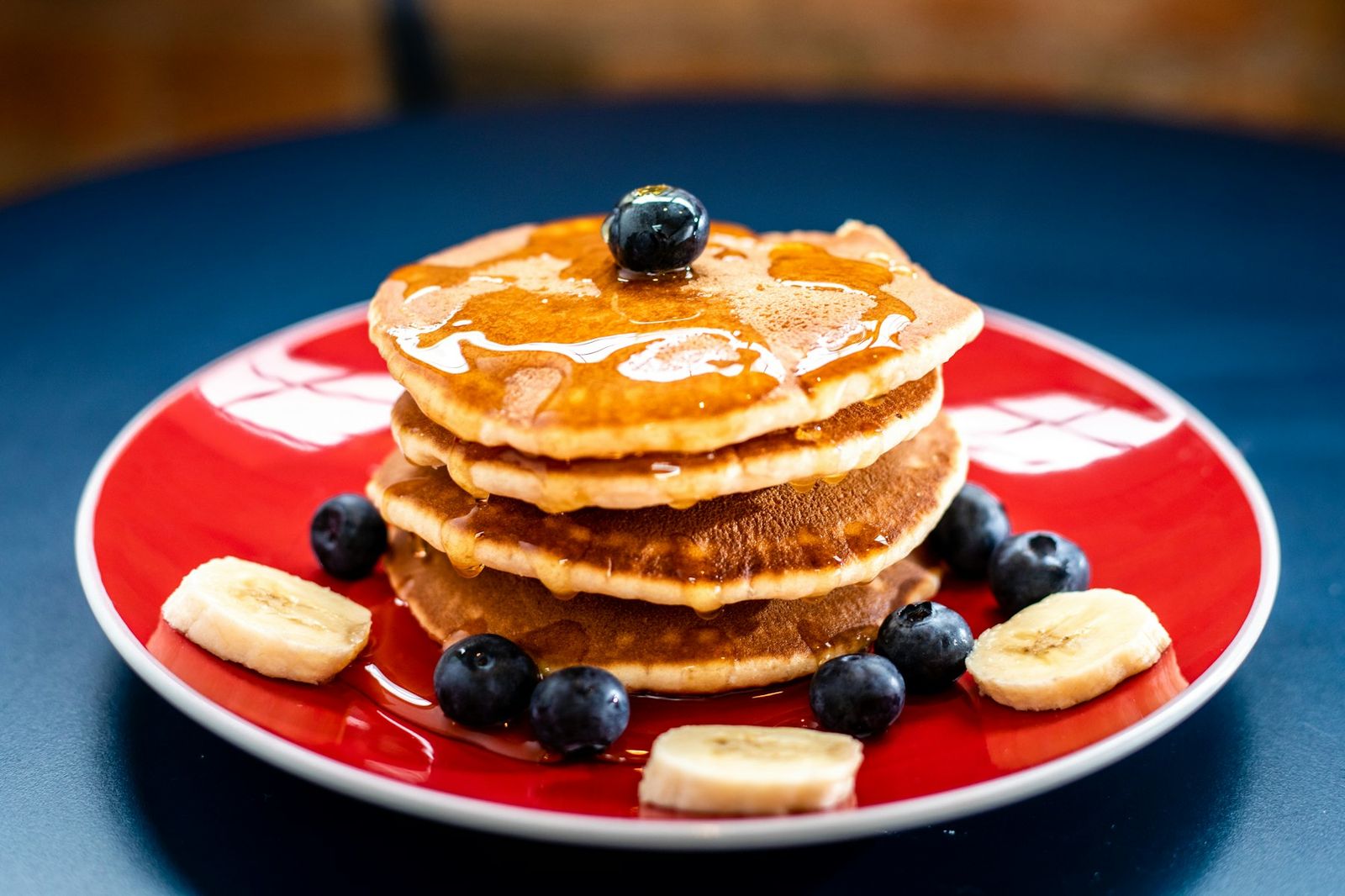 A diner breakfast plate — pancakes and fruit. Vibe shot, not Coach’s menu.